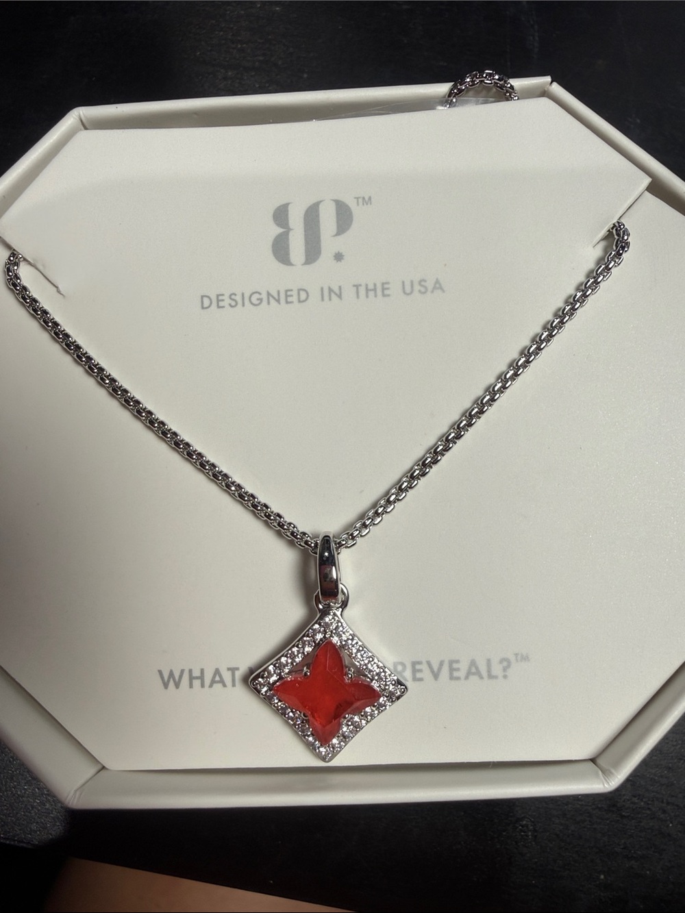 Designed in the USA Silver Necklace with Red Starflower Pendant